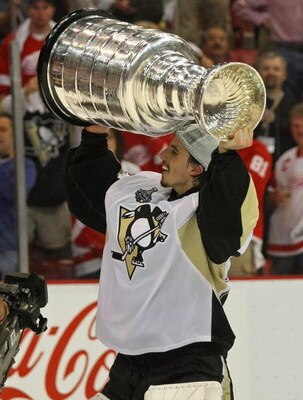 DETROIT - JUNE 12:  Goaltender Marc-Andre Fleury #29 of the Pittsburgh Penguins celebrates with the Stanley Cup after defeating the Detroit Red Wings by a score of 2-1 to win Game Seven and the 2009 NHL Stanley Cup Finals at Joe Louis Arena on June 12, 20