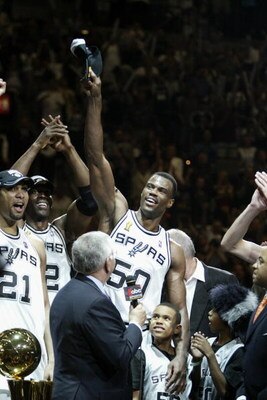 SAN ANTONIO, TX - JUNE 15:  David Robinson #50 of the San Antonio Spurs acknowledges the crowd after defeating the New Jersey Nets in game six of the 2003 NBA Finals on June 15, 2003 at the SBC Center in San Antonio, Texas.  The Spurs won 88-77 and defeat