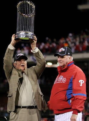 PHILADELPHIA - OCTOBER 29:  (L-R) General Manager Pat Gillick and manager Charlie Manuel #41 of of the Philadelphia Phillies celebrate with the World Series trophy after their 4-3 win against the Tampa Bay Rays during the continuation of game five of the 