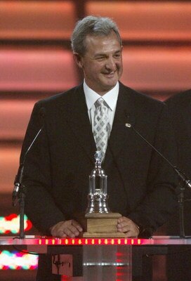 VANCOUVER, BC - JUNE 22:  Head coach Darryl Sutter of the Calgary Flames accepts the Vezina Trophy for his player Miikka Kiprusoff, not in attendance, at the NHL TV Awards Show at The Centre in Vancouver for Performing Arts on June 22, 2006 in Vancouver, 