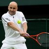 LONDON, ENGLAND - MAY 17:  Andre Agassi hits a backhand during the Mens Singles match against Tim Henman during the 'Centre Court Celebration' at Wimbledon on May 17, 2009 in London, England.  (Photo by Hamish Blair/Getty Images)