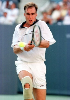 12 Sep 1999: Todd Martin returns a shot to Andre Agassi during the singles final of the US Open at the USTA National Tennis Center in Flushing Meadows, New York, New York.  Mandatory Credit: Clive Brunskill/ALLSPORT