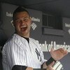NEW YORK - JULY 2:  Nick Swisher #33 of the New York Yankees sits in the dugout before a game against the Seattle Mariners at Yankee Stadium on July 2, 2009 in the Bronx borough of New York City.  (Photo by Nick Laham/Getty Images)