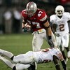 COLUMBUS, OH - SEPTEMBER 10:  Linebacker A.J. Hawk #47 of the Ohio State Buckeyes avoids the tackle of wide receiver Mark McCoy #25 of the Texas Longhorns after a fumble recovery during the second quarter at Ohio Stadium on September 10, 2005 in Columbus,