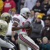 WEST LAFAYETTE, IN - NOVEMBER 9:  Split end Michael Jenkins #12 of the Ohio State Buckeyes hauls in the game-winning touchdown pass in the fourth quarter over cornerback Antwaun Rogers #12 of the Purdue Boilermakers during the Big 10 Conference football g