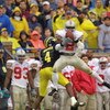 ANN ARBOR, MI - NOVEMBER 24:  Safety Michael Doss #2 of the Ohio State Buckeyes intercepts the ball over wide receiver Marquise Walker #4 of the Michigan Wolverines during the Big Ten Conference football game on November 24, 2001 at Michigan Stadium in An