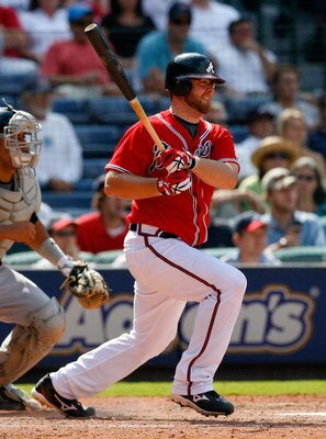 ATLANTA - AUGUST 23:  Brian McCann #16 of the Atlanta Braves hits a two-run single in the bottom of the eighth inning against the Florida Marlins on August 23, 2009 at Turner Field in Atlanta, Georgia.  (Photo by Kevin C. Cox/Getty Images)