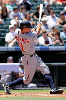 DENVER - JULY 08:  Ryan Zimmerman #11 of the Washington Nationals takes an at bat against the Colorado Rockies during MLB action at Coors Field on July 8, 2009 in Denver, Colorado. The Rockies defeated the Nationals 10-4.  (Photo by Doug Pensinger/Getty I