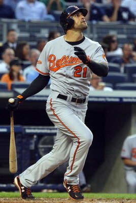 NEW YORK - JULY 20:  Nick Markakis #21 of the Baltimore Orioles bats against the New York Yankees on July 20, 2009 at Yankee Stadium in the Bronx borough of New York City.  (Photo by Jim McIsaac/Getty Images)