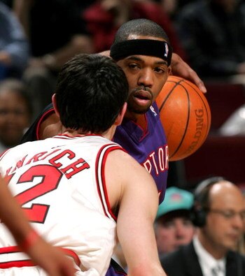 CHICAGO - APRIL 9:  Rafer Alston #11 of the Toronto Raptors looks at Kirk Hinrich #12 of the Chicago Bulls before making a move on April 9, 2005 at the United Center in Chicago, Illinois. The Bulls defeated the Raptors 110-97 to secure their first playoff