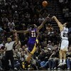 SAN ANTONIO - JANUARY 14:  Manu Ginobili #20 of the San Antonio Spurs takes a shot against Josh Powell #21 of the Los Angeles Lakers on January 14, 2009 at AT&T Center in San Antonio, Texas.  NOTE TO USER: User expressly acknowledges and agrees that, by d