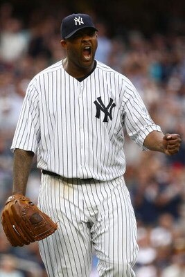 NEW YORK - AUGUST 08:  CC Sabathia #52 of the New York Yankees celebrates the final out in the seventh inning against the Boston Red Sox during their game on August 8, 2009 at Yankee Stadium in the Bronx borough of New York City.  (Photo by Chris McGrath/