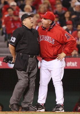ANAHEIM, CA - APRIL 04:   Manager Mike Scioscia of the Los Angeles Angels of Anaheim argues with home plate umpire Derryl Cousins in the eighth inning against the Texas Rangers at Angels Stadium April 4, 2008 in Anaheim, California.  (Photo by Lisa Blumen