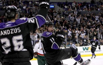 LOS ANGELES - MARCH 7:  Anze Kopitar #11 and Michal Handzus #26 of the Los Angeles Kings celebrate Kopitar's second period goal against the Minnesota Wild on March 7, 2009 at Staples Center in Los Angeles, California.   (Photo by Stephen Dunn/Getty Images