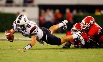 ATHENS, GA - SEPTEMBER 12:  Darryl Gamble #50 and Cornelius Washington #83 of the Georgia Bulldogs sack quarterback Stephen Garcia #5 of the South Carolina Gamecocks at Sanford Stadium on September 12, 2009 in Athens, Georgia.  (Photo by Kevin C. Cox/Gett