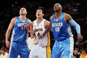 LOS ANGELES, CA - APRIL 20:  Linas Kleiza #43 and Carmelo Anthony #15 of the Denver Nuggets box out Luke Walton #4 of the Los Angeles Lakers in Game One of the Western Conference Quarterfinals during the 2008 NBA Playoffs at Staples Center on April 20, 20