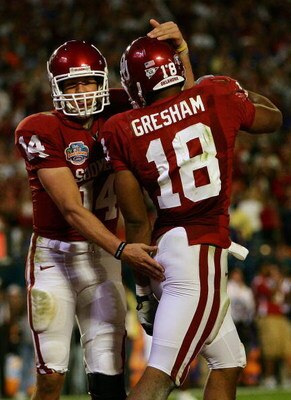 MIAMI - JANUARY 08:  Sam Bradford #14 of the Oklahoma Sooners celebrates with teammates Jermaine Gresham #18 after scoring a touchdown againist the Florida Gators during the FedEx BCS National Championship Game at Dolphin Stadium on January 8, 2009 in Mia
