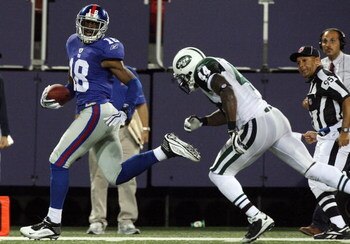 EAST RUTHERFORD, NJ - AUGUST 29:  Hakeem Nicks #18 of the New York Giants runs a reception past James Ihedigbo #44 of the New York Jets for a fourth quarter touchdown on August 29, 2009 at Giants Stadium in East Rutherford, New Jersey.  (Photo by Jim McIs