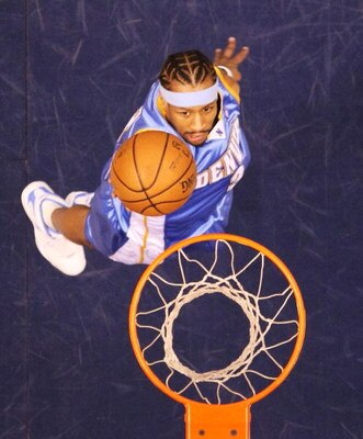 EAST RUTHERFORD, NJ - MARCH 21:  Allen Iverson #3 of the Denver Nuggets scores a layup against the New Jersey Nets during their game on March 21, 2008 at the Izod Arena in East Rutherford, New Jersey.  Photo By Al Bello/Getty Images.  NOTE TO USER: User e