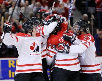 OTTAWA, ON - JANUARY 3:  Members of Team Canada celebrate the goal by Patrice Cormier #28 of Team Canada during the game against Team Russia at the semifinals at the IIHF World Junior Championships at Scotiabank Place on January 03, 2009 in Ottawa, Ontari