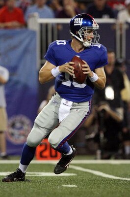 EAST RUTHERFORD, NJ - AUGUST 17:  Eli Manning #10 of the New York Giants looks to pass against the Carolina Panthers on August 17, 2009 at Giants Stadium in East Rutherford, New Jersey. The Giants defeated the Panthers 24-17.  (Photo by Jim McIsaac/Getty 