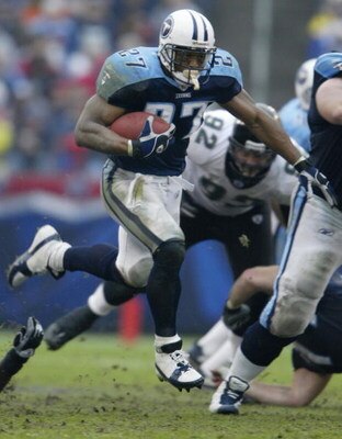 NASHVILLE, TN - NOVEMBER 16:  Eddie George #27 of the Tennessee Titans carries the ball against the Jacksonville Jaguars on November 16, 2003 at The Coliseum in Nashville, Tennessee. The Titans won 10-3.  (Photo by Elsa/Getty Images)