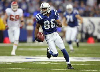 INDIANAPOLIS - JANUARY 06:  Marvin Harrison #88 of the Indianapolis Colts runs for yards after the catch on a 42-yard reception in the first quarter against the Kansas City Chiefs during their AFC Wild Card Playoff Game January 6, 2007 at RCA Dome in Indi