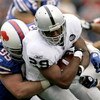 ORCHARD PARK, NY - SEPTEMBER 21: Michael Bush #29 of the Oakland Raiders is tackled by Kyle Williams #95 on September 21, 2008 at Ralph Wilson Stadium in Orchard Park, New York. Buffalo won 24-23. (Photo by Rick Stewart/Getty Images)