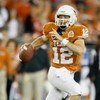 GLENDALE, AZ - JANUARY 05:  Quarterback Colt McCoy #12 of the Texas Longhorns scrambles with the ball against the Ohio State Buckeyes during the Tostitos Fiesta Bowl Game on January 5, 2009 at University of Phoenix Stadium in Glendale, Arizona.  (Photo by
