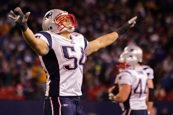 EAST RUTHERFORD, NJ - DECEMBER 29:  Tedy Bruschi #54 of the New England Patriots celebrates on the field at the end of the game against the New York Giants on December 29, 2007 at Giants Stadium in East Rutherford, New Jersey.  (Photo by Jim McIsaac/Getty
