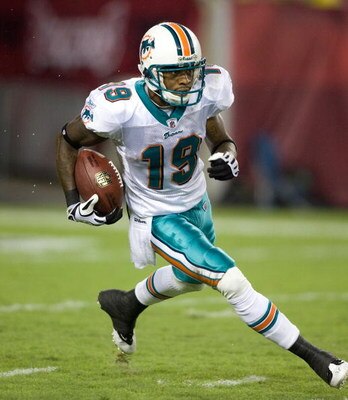 TAMPA, FL - AUGUST 27:  Receiver Ted Ginn, Jr. #19 of the Miami Dolphins runs the ball on a kick off against the Tampa Bay Buccaneers during a preseason game at Raymond James Stadium on August 27, 2009 in Tampa, Florida.  (Photo by J. Meric/Getty Images)
