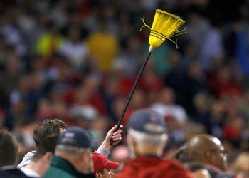 BOSTON - APRIL 26: A fan hold a broom to indicate a three-game Boston Red Sox sweep over the New York Yankees at Fenway Park April 26, 2009 in Boston, Massachusetts. The Red Sox won the game 4-1. (Photo by Jim Rogash/Getty Images)