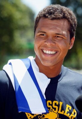 MELBOURNE, AUSTRALIA - JANUARY 15:  Jo-Wilfried Tsonga of France poses with a Kangaroos AFL guernsey offcourt on day two of the Australian Open 2008 at Melbourne Park on January 15, 2008 in Melbourne, Australia.  (Photo by James Knowler/Getty Images)