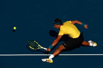 NEW YORK - SEPTEMBER 02:  Rafael Nadal of Spain returns a shot against Richard Gasquet of France during day three of the 2009 U.S. Open at the USTA Billie Jean King National Tennis Center on September 2, 2009 in Flushing neighborhood of the Queens borough