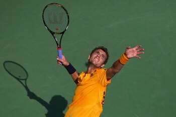 NEW YORK - AUGUST 31:  Paul-Henri Mathieu of France serves to Mikhail Youzhny of Russia during day one of the 2009 U.S. Open at the USTA Billie Jean King National Tennis Center on August 31, 2009 in Flushing neighborhood of the Queens borough of New York 