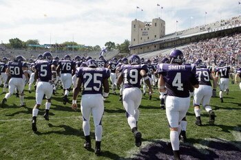 EVANSTON, IL - SEPTEMBER 8: The Northwestern Wildcats run onto the field before the game against the Nevada Wolf Pack on September 8, 2007 at Ryan Field at Northwestern University in Evanston, Illinois. (Photo by Jonathan Daniel/Getty Images)