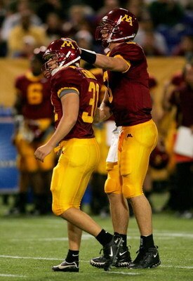 MINNEAPOLIS, MN - SEPTEMBER 24:  Jason Gianini #31 of Minnesota is congratulated by Bryan Cupito #3 after kicking a field goal against Purdue during the first quarter on September 24, 2005 at the Hubert H. Humphrey Metrodome in Minneapolis, Minnesota.  (P