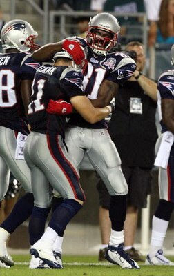 PHILADELPHIA - AUGUST 13:  Julian Edelman #11 of the New England Patriots celebrates his touchdown against the Philadelphia Eagles with teammate Randy Moss #81 on August 13, 2009 at Lincoln Financial Field in Philadelphia, Pennsylvania.  (Photo by Jim McI