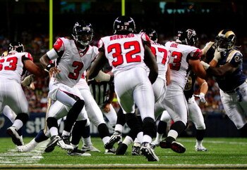 ST. LOUIS, MO - AUGUST 21:  Quarterback D.J. Shockley #3 of the Atlanta Falcons hands off to running back Jerious Norwood #32 during the preseason game against the St. Louis Rams at the Edward Jones Dome on August 21, 2009 in St. Louis, Missouri. (Photo b
