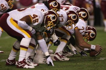 LANDOVER, MD - SEPTEMBER 27:  The Washington Redskins offensive line sets for the snap of the ball during the fourth quarter of their game against the Dallas Cowboys in the third week of the NFL season at FedEx Field September 27, 2004 in Landover, Maryla