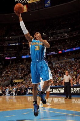 DENVER - APRIL 22:  David West #30 of the New Orleans Hornets lays up a shot against the Denver Nuggets in Game Two of the Western Conference Quarterfinals during the 2009 NBA Playoffs at Pepsi Center on April 22, 2009 in Denver, Colorado. NOTE TO USER: U