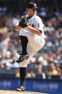 NEW YORK - AUGUST 27:  David Robertson #30 of The New York Yankees in action against The Texas Rangers during their game on August 27th, 2009 at Yankee Stadium in the Bronx Borough of New York.  (Photo by Al Bello/Getty Images)