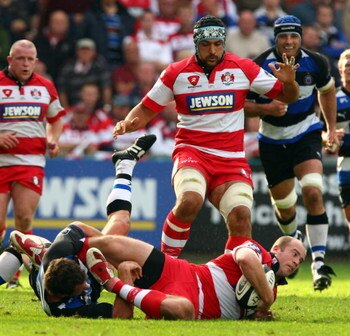 GLOUCESTER, ENGLAND - SEPTEMBER 06:  James Simpson-Daniel of Gloucester runs into a tackle during the Guinness Premiership game between Gloucester and Bath on September 6, 2009 in Gloucester, England.  (Photo by John Gichigi/Getty Images)