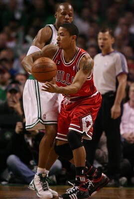 BOSTON - MAY 02:  Derrick Rose #1 of the Chicago Bulls passes the ball around Ray Allen #20 of the Boston Celtics in Game Seven of the Eastern Conference Quarterfinals during the 2009 NBA Playoffs at TD Banknorth Garden on May 2, 2009 in Boston, Massachus