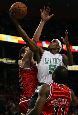 BOSTON - APRIL 20:  Rajon Rondo #9 of the Boston Celtics is fouled by Brad Miller #52 of the Chicago Bulls in Game Two of the Eastern Conference Quarterfinals during the 2009 NBA Playoffs at TD Banknorth Garden on April 20, 2009 in Boston, Massachusetts. 