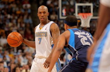 DENVER - MAY 03:  Chauncey Billups #7 of the Denver Nuggets controls the ball as Antoine Wright #21 of the Dallas Mavericks defends in Game One of the Western Conference Semifinals during the 2009 NBA Playoffs at Pepsi Center on May 3, 2009 in Denver, Col
