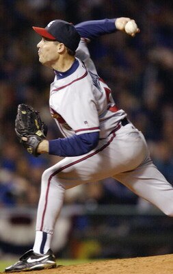 CHICAGO - OCTOBER 3:  Greg Maddux #31 of the Atlanta Braves throws against the Chicago Cubs during game three of the National League Division Series on October 3, 2003 at Wrigley Field in Chicago, Illinois.  The Cubs defeated the Braves 3-1.  (Photo by Br