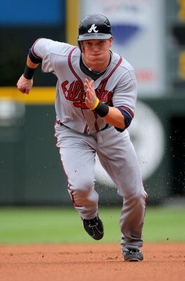 DENVER - JULY 12:  Nate McLouth #13 of the Atlanta Braves heads for thirdbase on a Martin Prado single in the first inning against the Colorado Rockies during MLB action at Coors Field on July 12, 2009 in Denver, Colorado. McLouth went on to score on a Ch