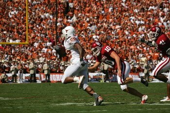DALLAS - OCTOBER 7:  Running back Selvin Young #22 of the Texas Longhorns runs the ball against the Oklahoma Sooners during the Red River Shootout at the Cotton Bowl on October 7, 2006 in Dallas, Texas. The Longhorns won 28-10. (Photo by Ronald Martinez/G