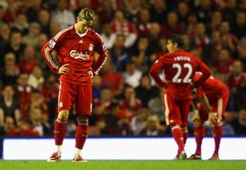 LIVERPOOL, ENGLAND - AUGUST 24:  Fernando Torres of Liverpool shows his dejection during the Barclays Premier League match between Liverpool and Aston Villa at Anfield on August 24, 2009 in Liverpool, England. (Photo by Clive Brunskill/Getty Images)